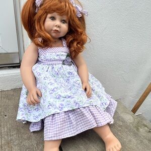 Adorable Red-Haired Doll with Purple Dress